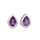 A PAIR OF AMETHYST SET EARRINGS, the pear shaped amethyst mounted in 18ct white gold