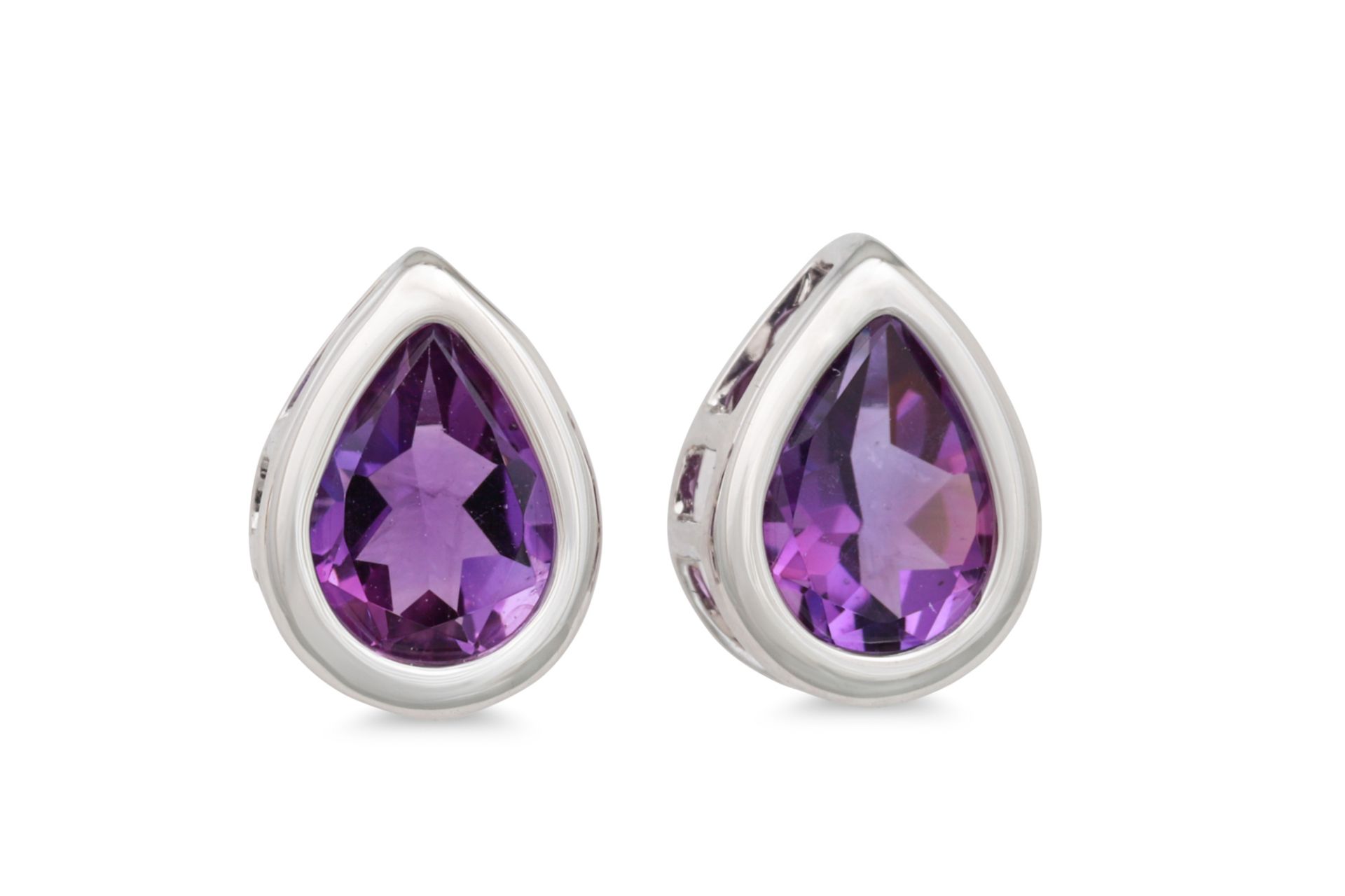 A PAIR OF AMETHYST SET EARRINGS, the pear shaped amethyst mounted in 18ct white gold