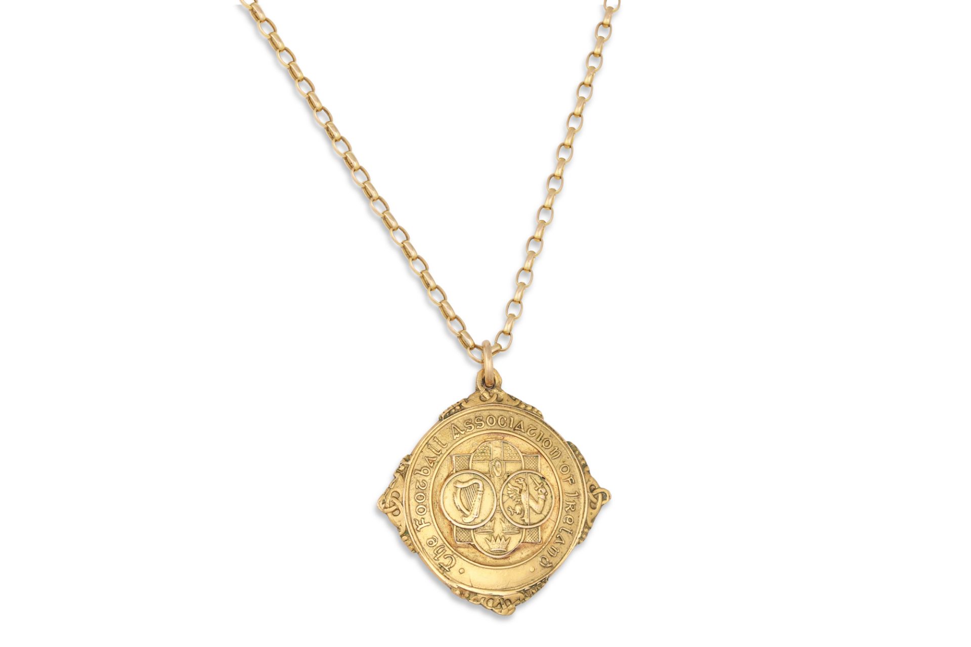 A 9CT GOLD FAI MEDAL, on a 9ct gold chain
