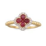 A RUBY AND DIAMOND CLUSTER RING, the central ruby to diamond surround, of shaped form, mounted in