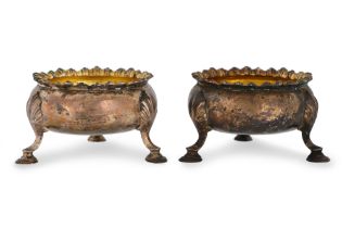 AN EARLY PAIR OF GEORGE III ROCOCO SALTS, gilded interior, egg & dart border raised on shell and