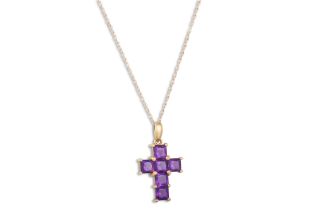 AN AMETHYST CROSS, mounted in 9ct gold on a yellow gold chain