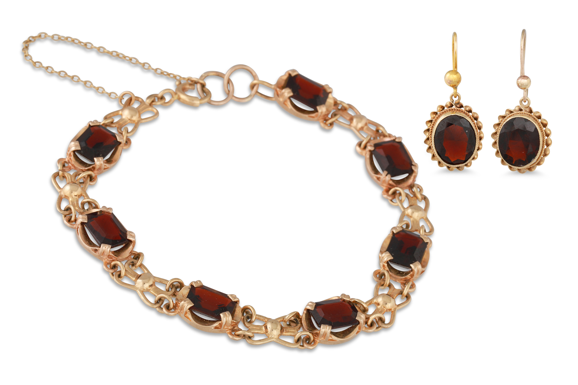 A GARNET BRACELET, in 9ct gold with matching earrings, 16.7 g.