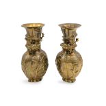 A PAIR OF ORIENTAL STYLE BRASS VASES, cast with recumbent deer, bamboo, and dragon motifs, 20th