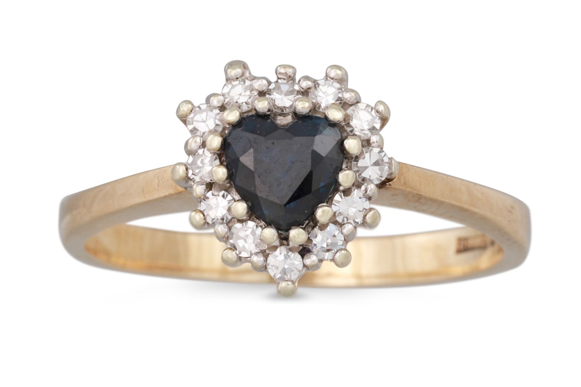A SAPPHIRE AND DIAMOND CLUSTER RING, the heart shaped sapphire to diamond surround, mounted in