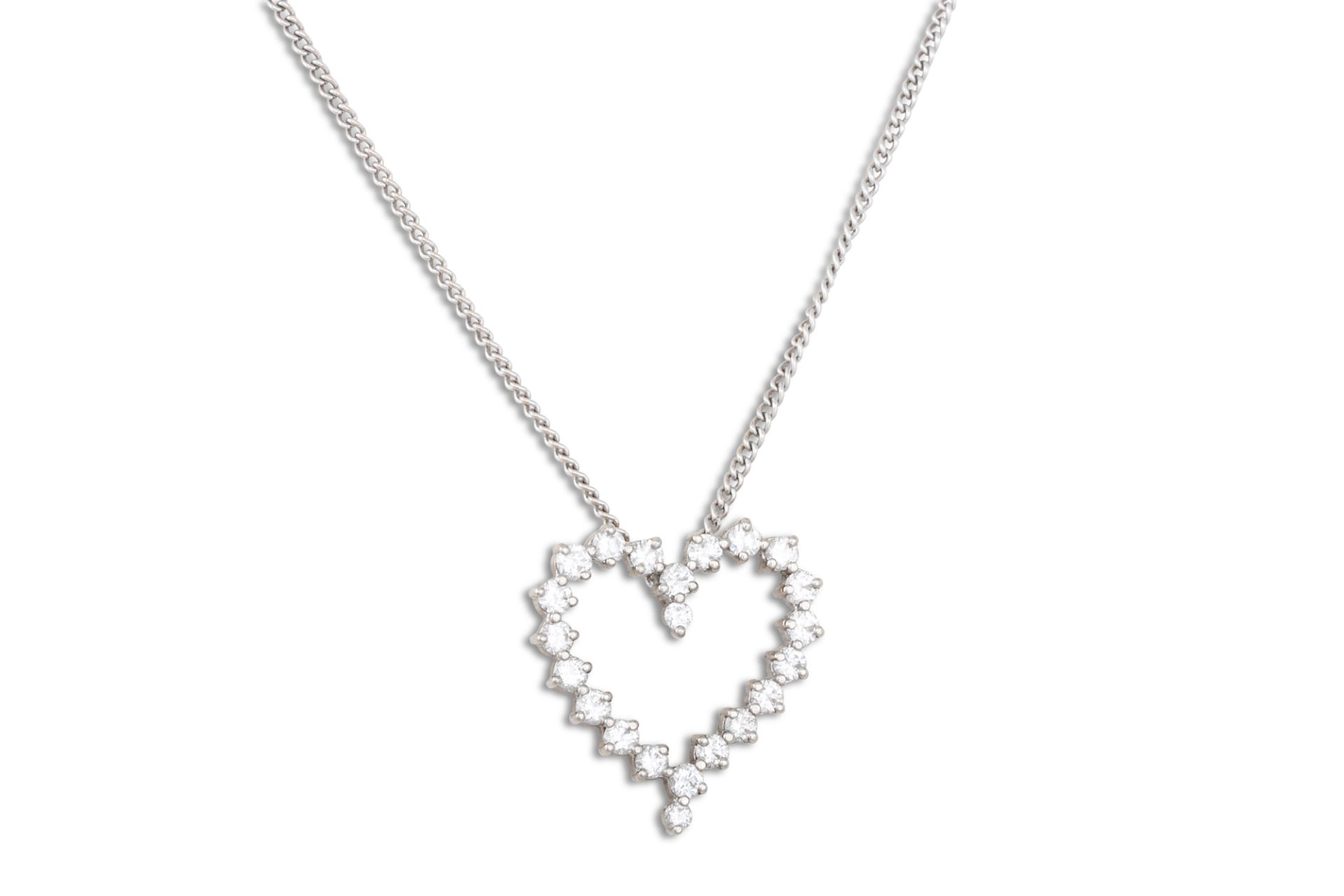 A DIAMOND PENDANT, the heart shaped pendant mounted in 18ct white gold, on a chain. Estimated: