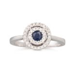A DIAMOND AND SAPPHIRE CLUSTER RING, the circluar sapphire to a two rowed diamond surround,