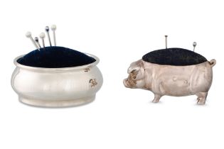 A MODERN SILVER NOVELTY PIN CUSHION, together with another silver pin cushion