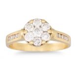 A DIAMOND CLUSTER RING, seven round brilliant cut illusion set diamonds to diamond shoulders,