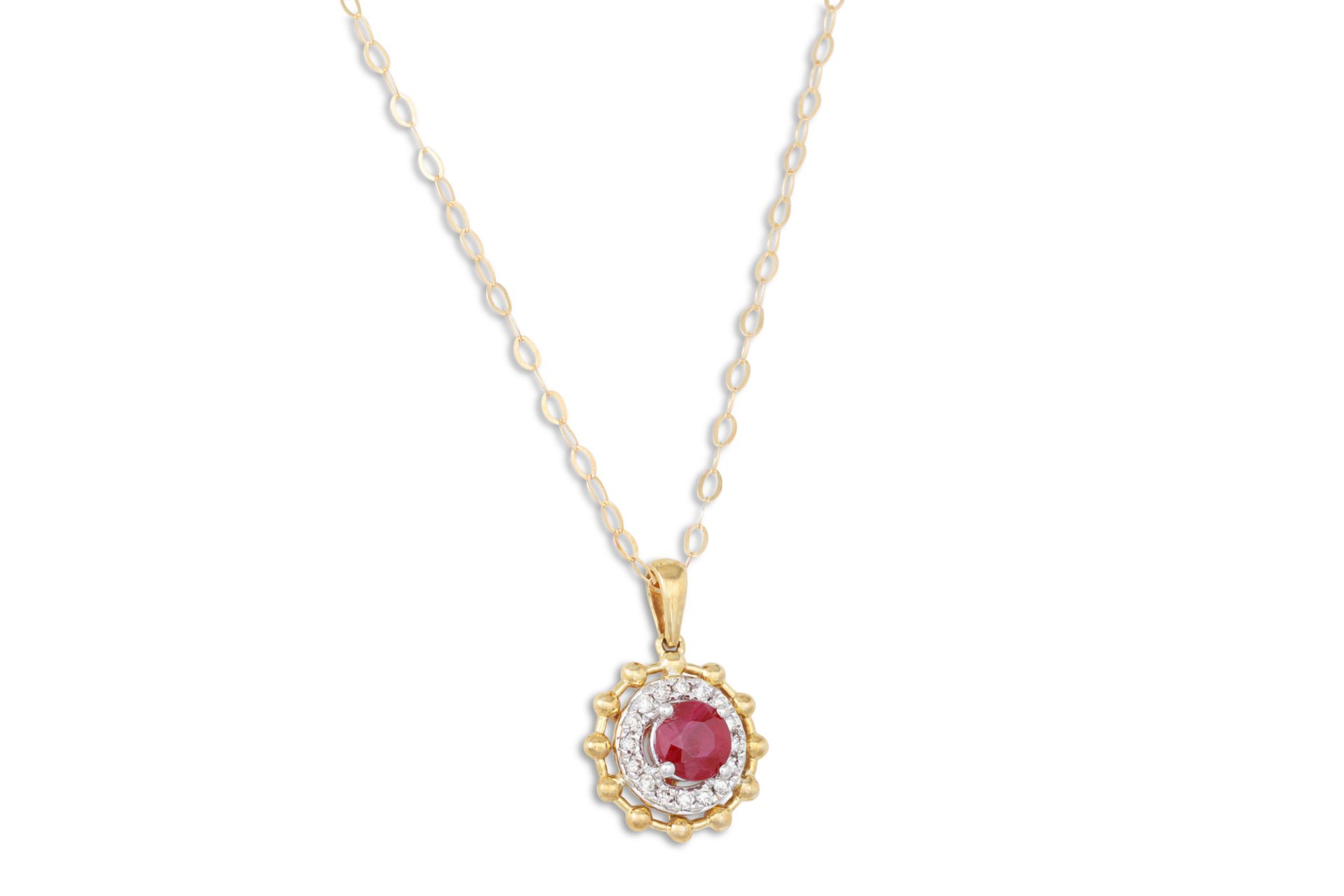 A DIAMOND AND RUBY PENDANT, the circular ruby to diamond surround, mounted in 9ct gold on a chain
