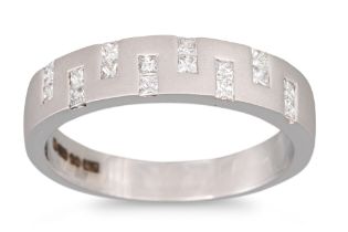 A DIAMOND HALF ETERNITY RING, of contemporary design, mounted in 18ct white gold. Estimated: