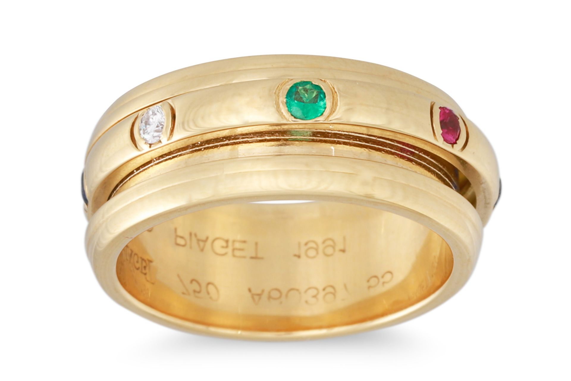 A PIAGET GEM-SET DRESS RING, mounted in 18ct gold, the swivelling inner section set with diamonds,