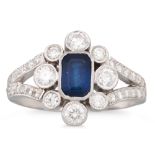A DIAMOND AND SAPPHIRE CLUSTER RING, the octagonal sapphire to a diamond surround & shoulders,