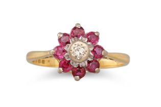 A RUBY AND DIAMOND RING, mounted in 18ct gold, size K - L