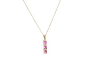 A THREE STONE RUBY DROP PENDANT, mounted in 9ct gold, on a chain