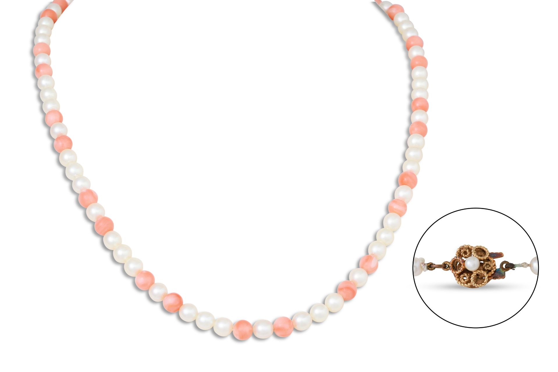 A MIKIMOTO CULTURED PEARL AND CORAL NECKLACE, the cream tone pears to coral spacers, to a 9ct gold