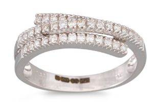 A DIAMOND RING, the triple row diamonds mounted in 9ct white gold, size L