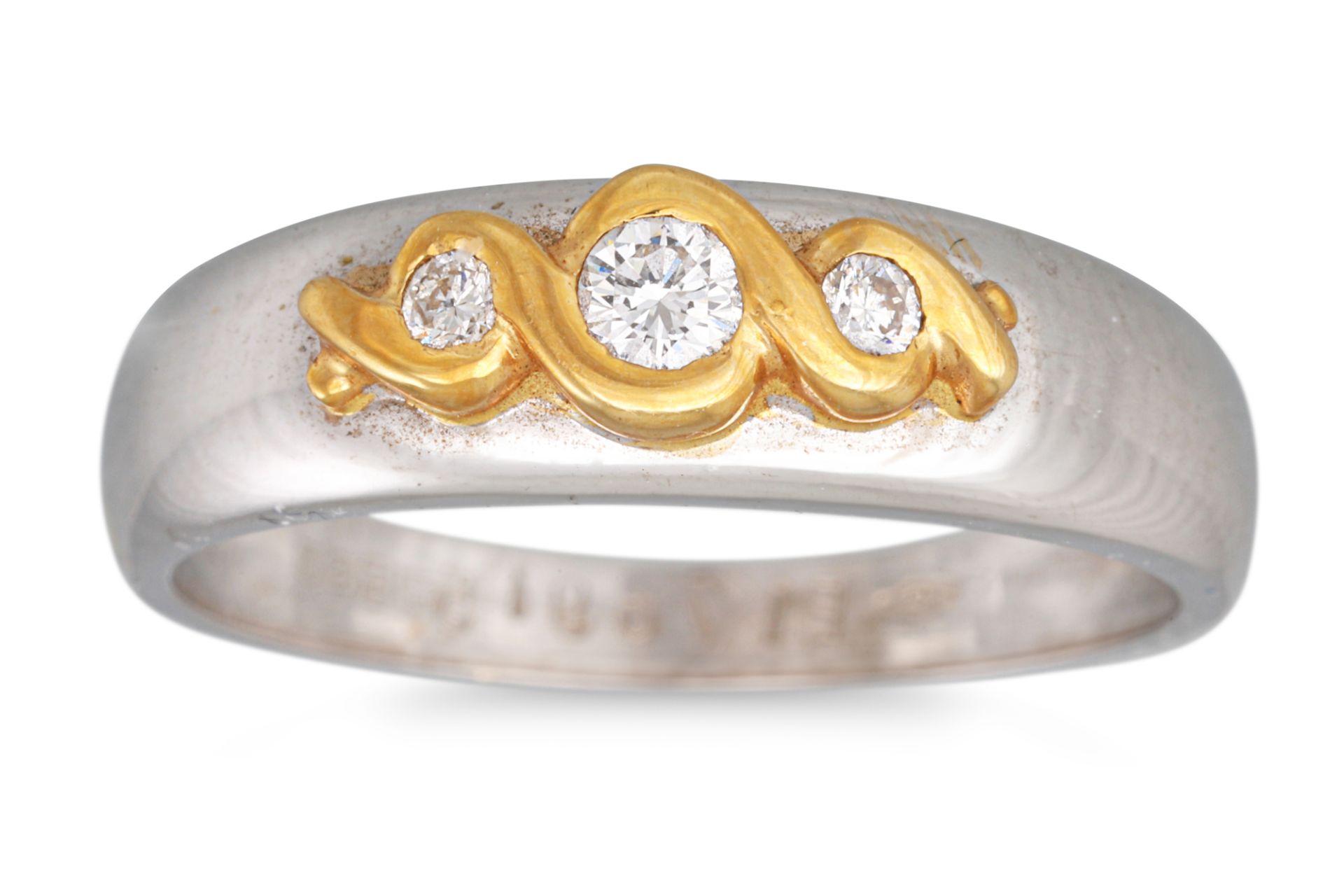 A THREE STONE DIAMOND RING, mounted in 18ct two colour gold, size N