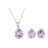 A DIAMOND AND AMETHYST PENDANT, the pear shaped amethyst to diamond surround, mounted in white gold,