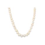 A BAROQUE PEARL NECKLACE, cream tones with a 9ct gold clasp