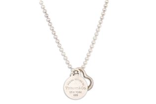 A SILVER TIFFANY NECKLACE, original heart pendant & Tiffany stamped disk