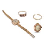 TWO VINTAGE GOLD WATCH HEADS, a garnet set dress ring, etc. gross weight 30 g.