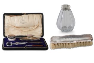 AN EARLY 20TH CENTURY TRAVELLING MANICURE SET, (cased) part silver, retailed by West & Sons.