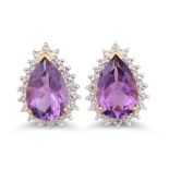 A PAIR OF DIAMOND AND AMETHYST EARRINGS, the pear shaped amethysts to diamond surrounds, mounted