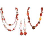 LINDA UHLEMANN (Irish Contemporary) two handmade necklaces, one with polished quartz of oval and