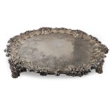 AN IMPRESSIVE WILLIAM IV CIRCULAR SILVER SALVER, with chased & engraved floral decoration, raised