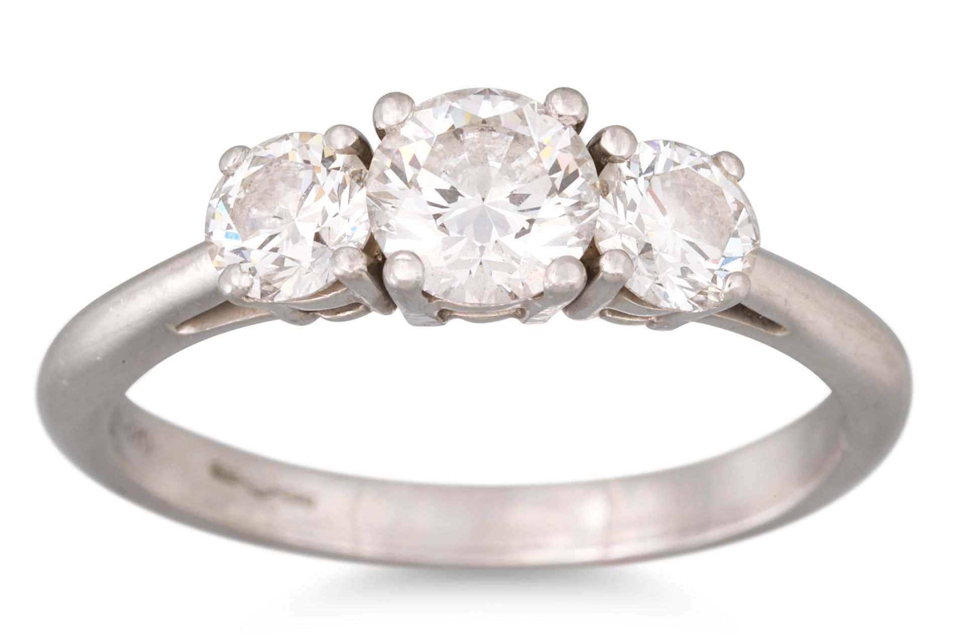 A THREE STONE DIAMOND RING, BY TIFFANY & CO., the brilliant cut diamonds mounted in platinum.