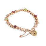 A GARNET AND PERIDOT CURB BRACELET, in gold, with padlock, 13.3 g.