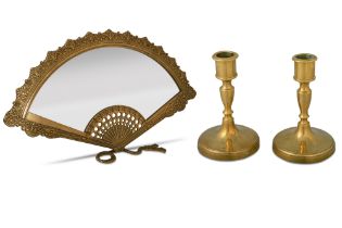 AN EDWARDIAN STYLE FAN SHAPED BRASS TABLE MIRROR, on a brass stand, together with a pair of brass