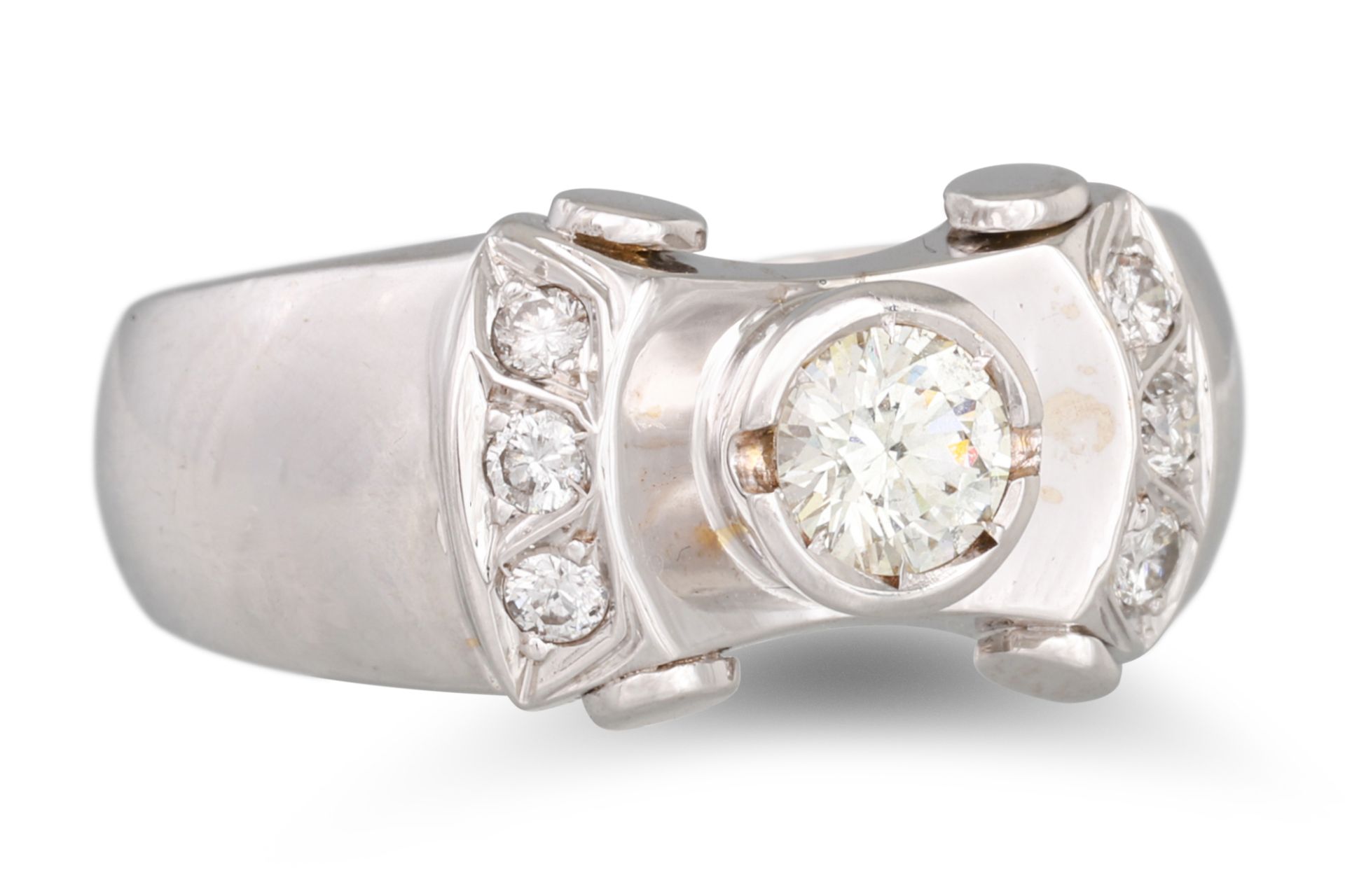 A DIAMOND DRESS RING, the brilliant cut collet diamond to diamond shoulders, mounted in 18ct white