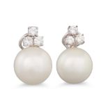 A PAIR OF SOUTH SEA PEARL AND DIAMOND EARRINGS, the white pearls surmounted by diamond trios, in