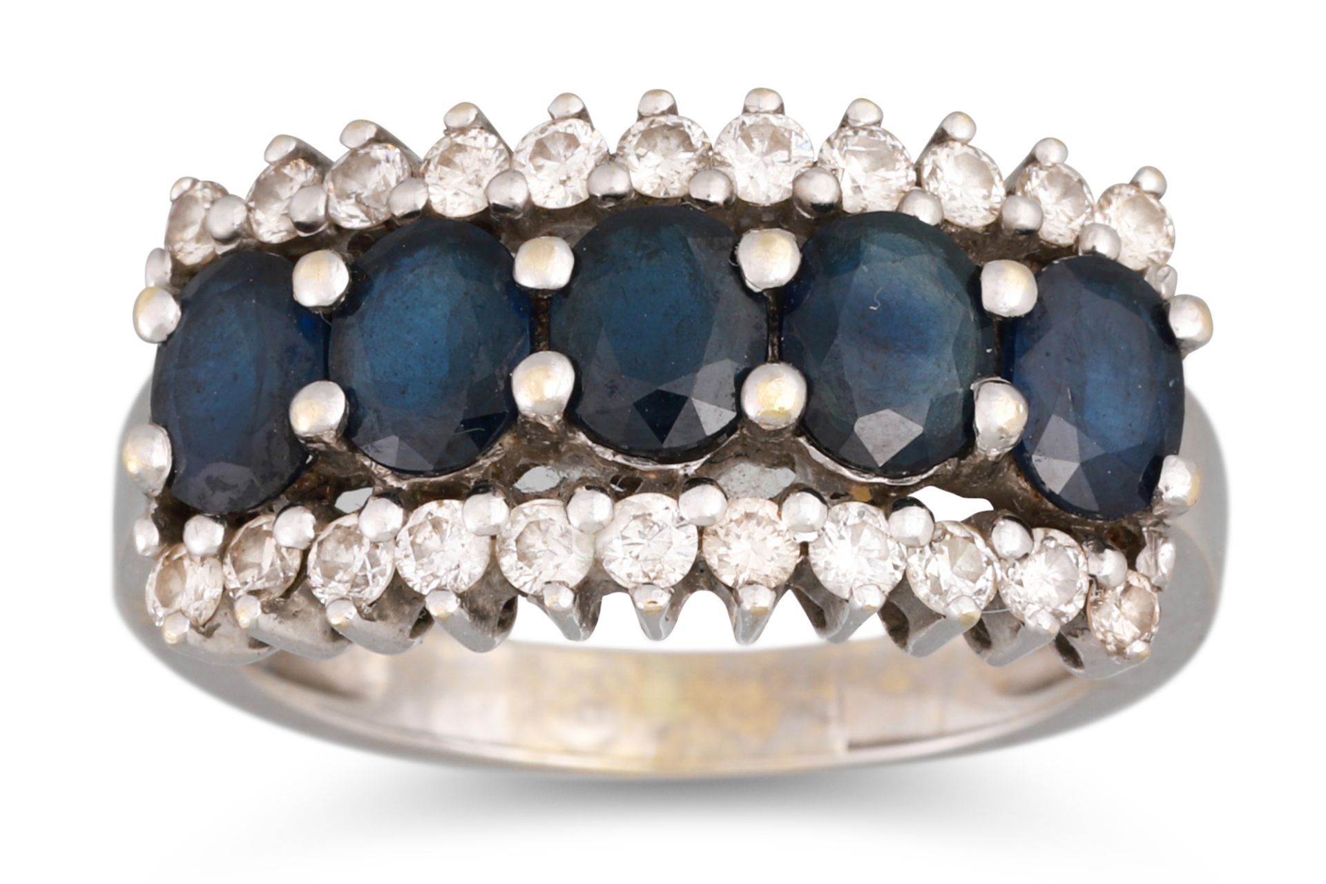 A SAPPHIRE AND DIAMOND DRESS RING, the five oval cut sapphires to round brilliant cut diamond