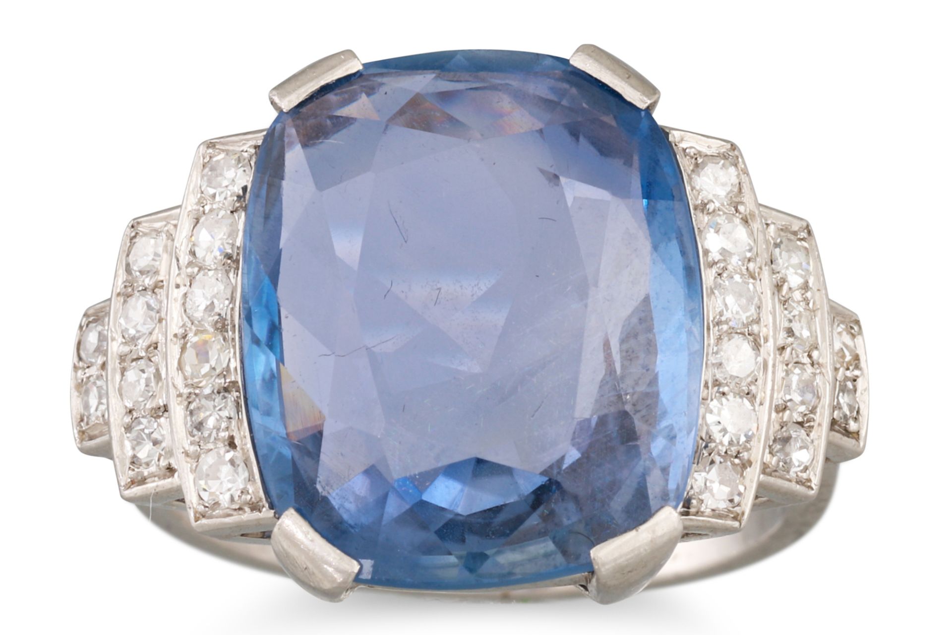 AN ART DECO SAPPHIRE AND DIAMOND RING, the cushion cut sapphire to stepped old cut diamond