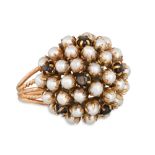 A CULTURED PEARL RING, bombé style, mounted in gold, size O, 8.3 g.