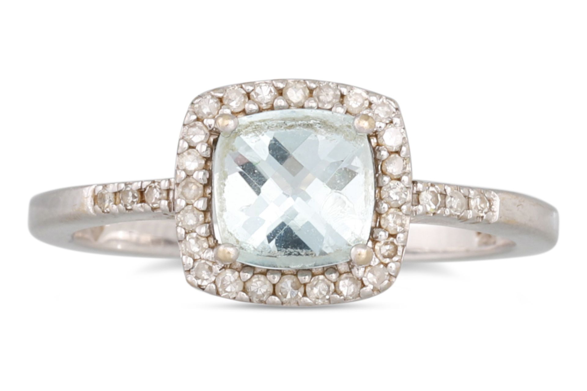 A DIAMOND AND AQUAMARINE CLUSTER RING, the mixed cut aquamarine to diamond surround and shoulders,