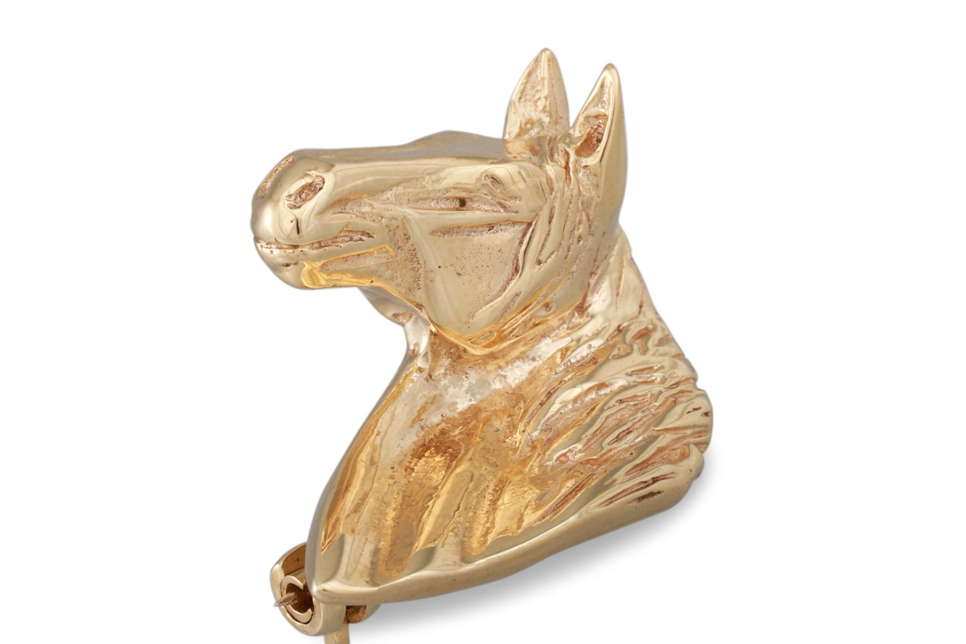 A 9CT GOLD BROOCH, in the form of a horse, 7.8 g.