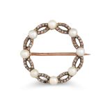 AN EDWARDIAN CIRCULAR CULTURED PEARL AND DIAMOND SET BROOCH, the old cut diamonds mounted in gold