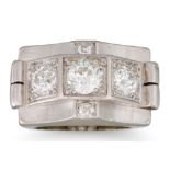 A 1940'S RETRO THREE STONE DIAMOND RING, the old cut diamond to an architectural style platinum