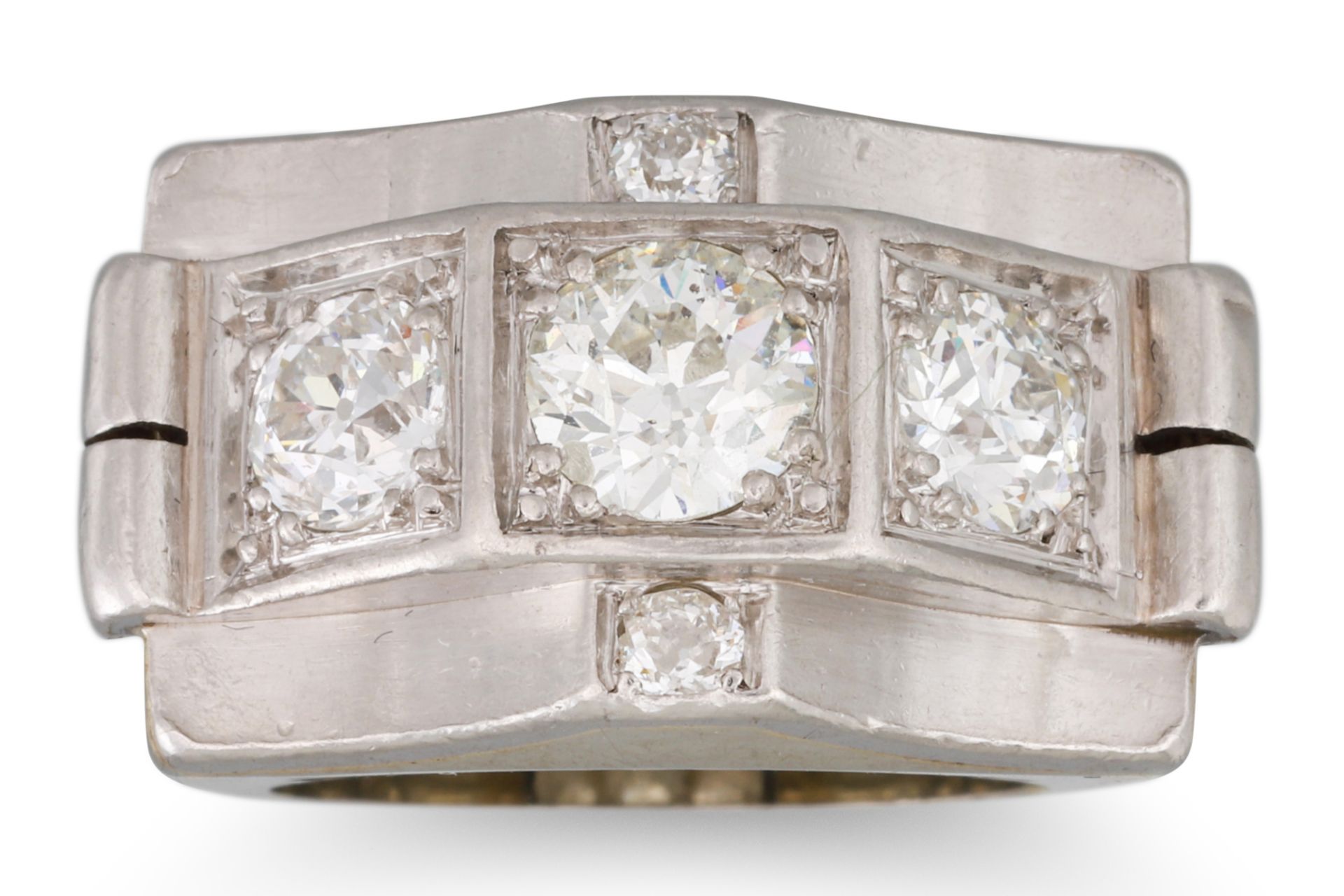 A 1940'S RETRO THREE STONE DIAMOND RING, the old cut diamond to an architectural style platinum