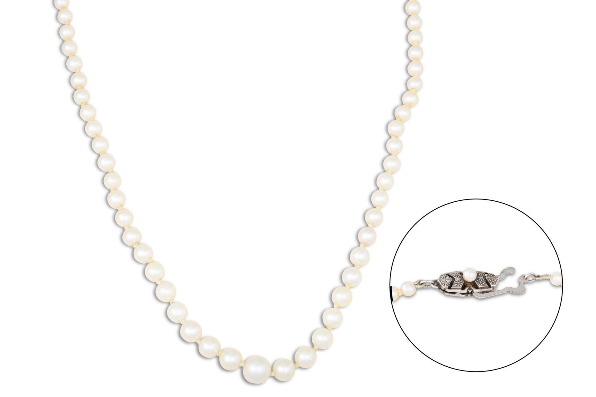 A STRING OF CULTURED PEARLS, to a silver clasp