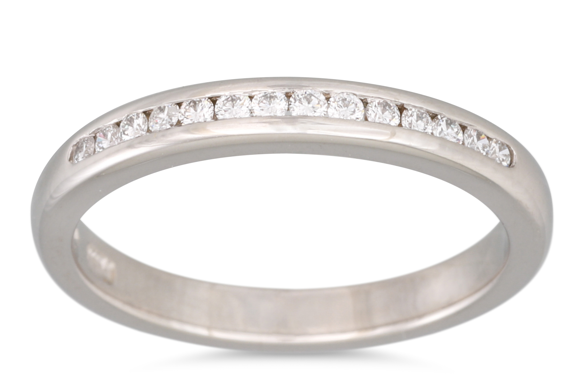 A DIAMOND HALF ETERNITY RING, the channel set half hoop eternity ring mounted in platinum, Dublin