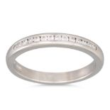 A DIAMOND HALF ETERNITY RING, the channel set half hoop eternity ring mounted in platinum, Dublin