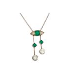 AN EDWARDIAN DIAMOND AND EMERALD DROP PENDANT, comprising a boat shaped diamond and emerald set