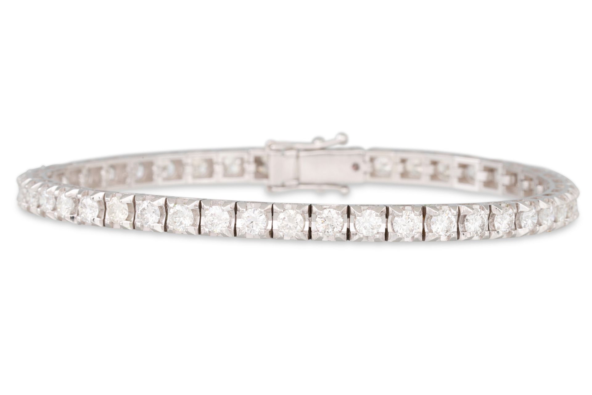 A DIAMOND LINE BRACELET, the round brilliant cut diamonds mounted in 18ct white gold. Together