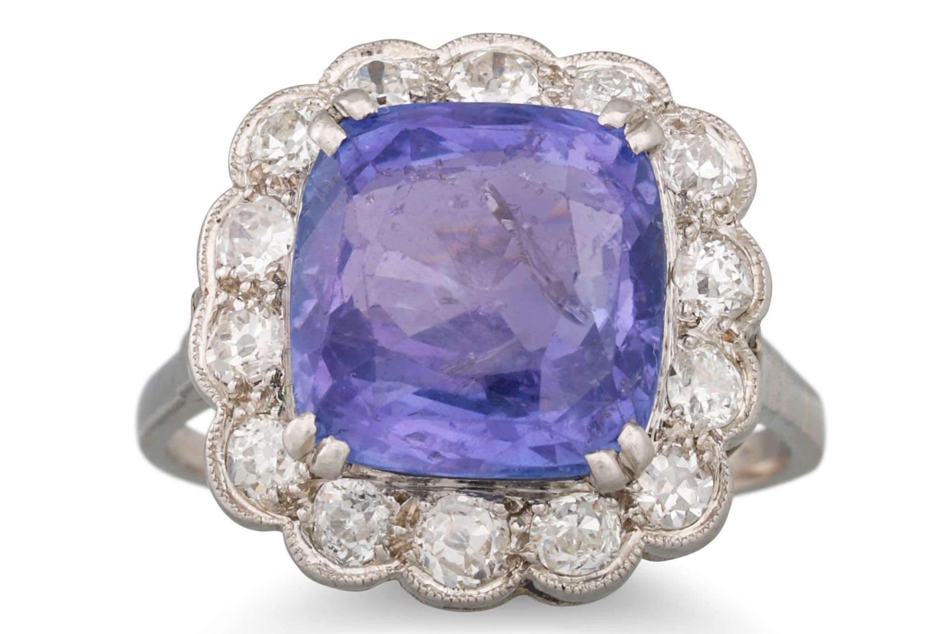 A VINTAGE SAPPHIRE AND DIAMOND CLUSTER RING, the cushion cut colour change sapphire to an old cut