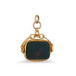 AN ANTIQUE 9CT GOLD SWIVEL SEAL, set with bloodstone and carnelian